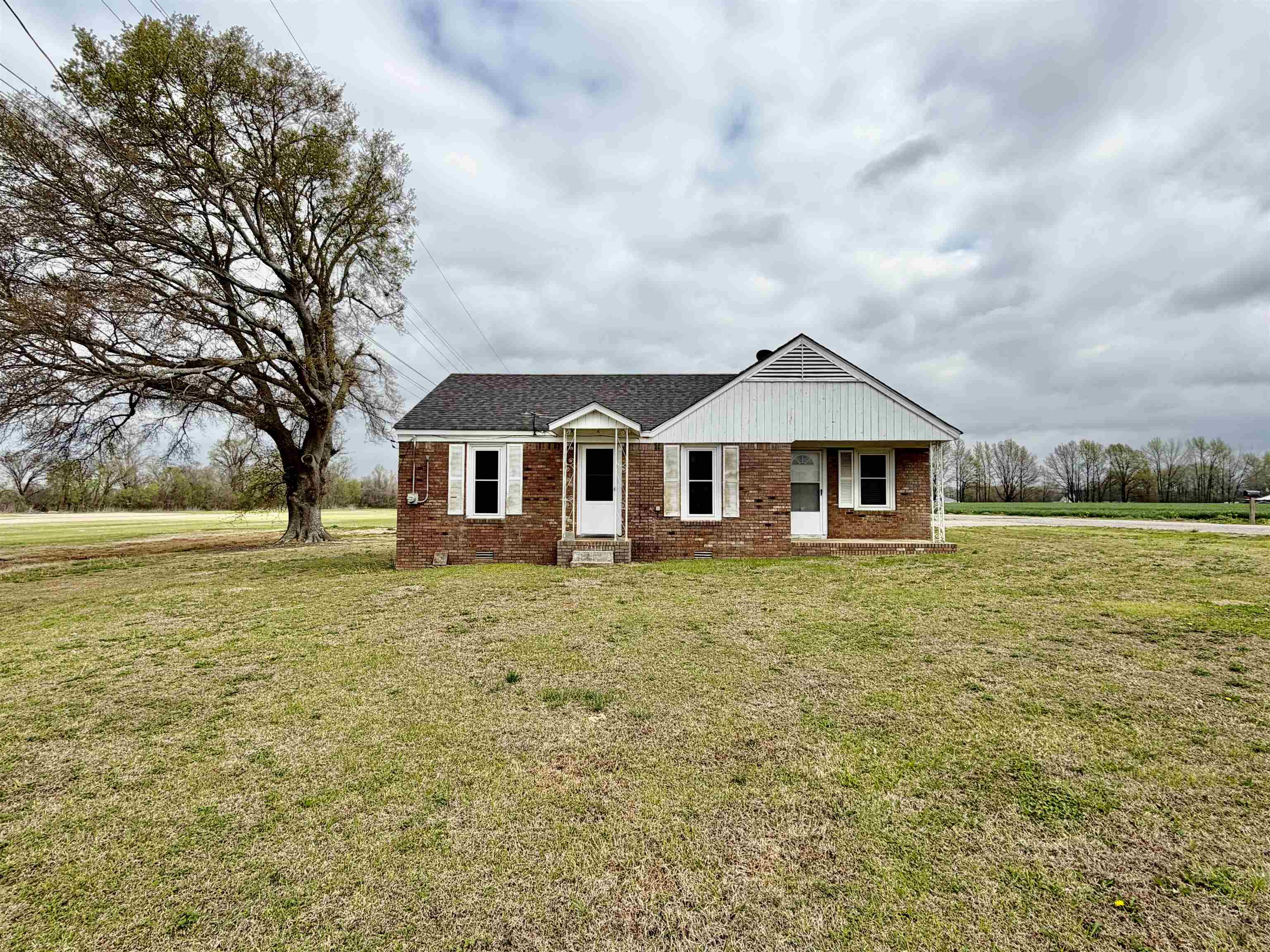 5442 Bride Road Covington, TN 38019 - Photo 2 of 19 View of front of property featuring a front yard and brick siding