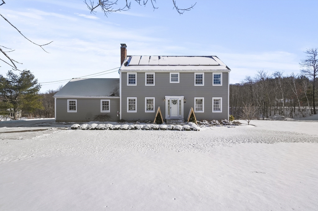56 Glenwood Road Rutland, MA 01543 - Photo 1 of 41 a front view of a house with a yard and garage