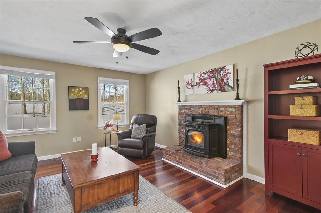 56 Glenwood Road Rutland, MA 01543 - Photo 12 of 41 a living room with furniture and a fireplace