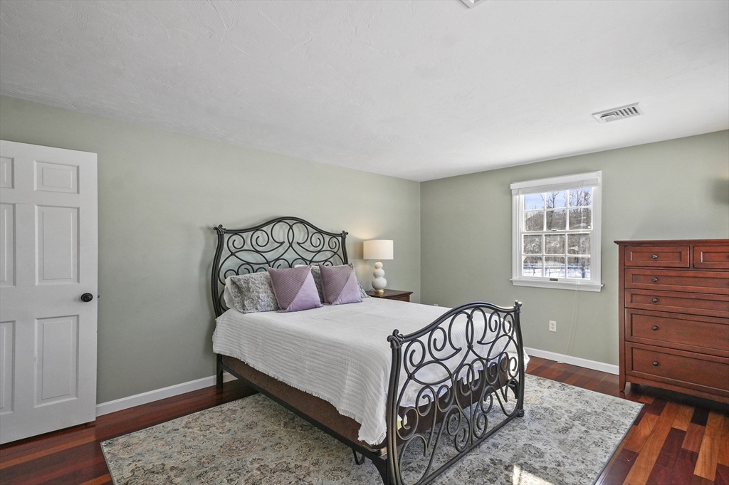 56 Glenwood Road Rutland, MA 01543 - Photo 17 of 41 a bedroom with a bed and a dresser