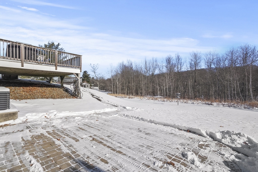 56 Glenwood Road Rutland, MA 01543 - Photo 37 of 41 a view of a terrace with a bench