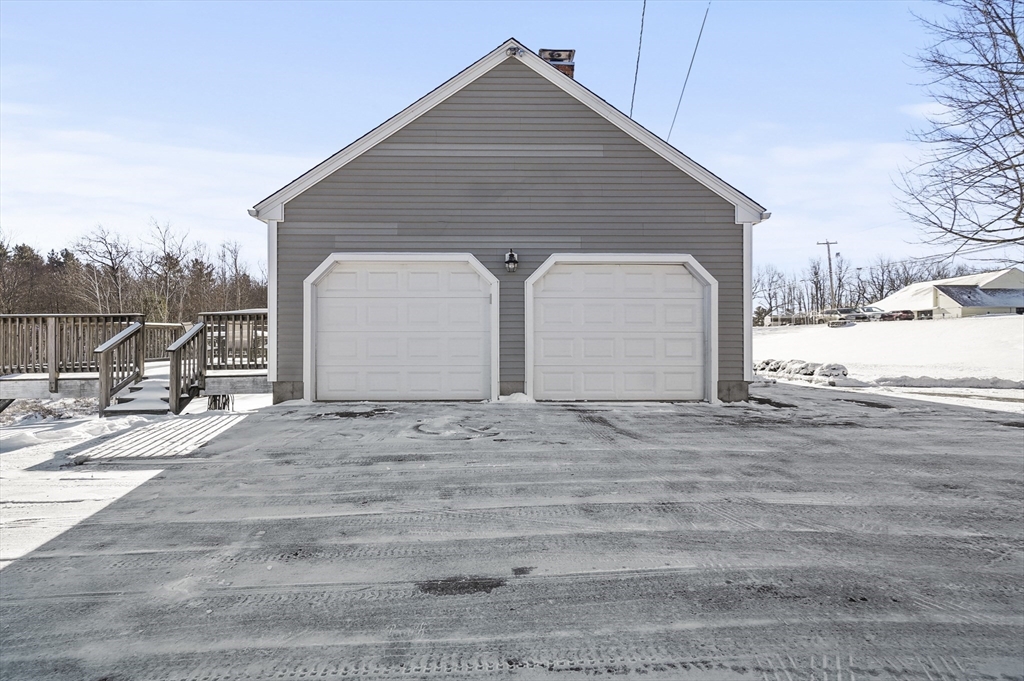 56 Glenwood Road Rutland, MA 01543 - Photo 38 of 41 a view of garage yard and wooden floor