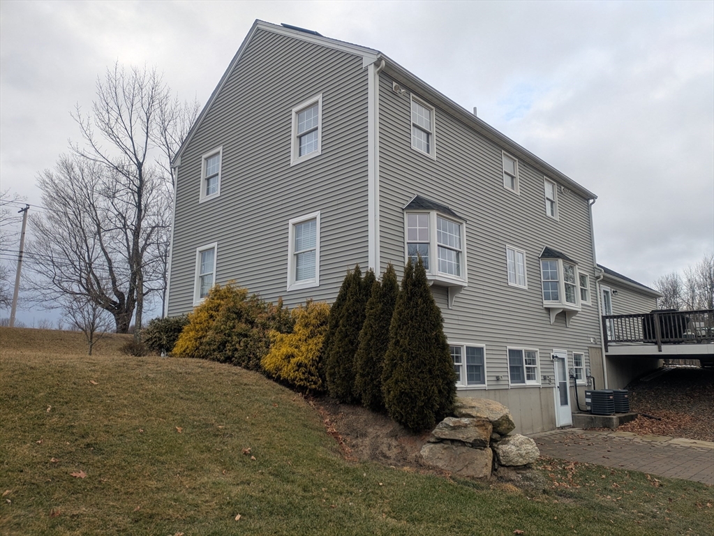 56 Glenwood Road Rutland, MA 01543 - Photo 40 of 41 a view of a house with a yard