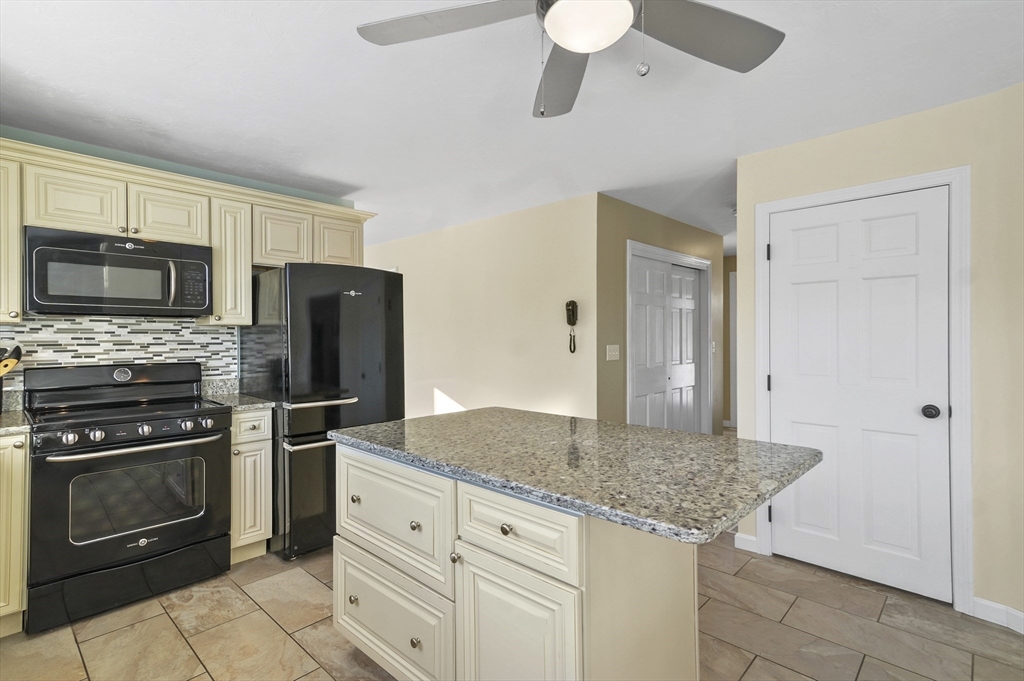 56 Glenwood Road Rutland, MA 01543 - Photo 6 of 41 a kitchen with stainless steel appliances granite countertop a stove and a refrigerator