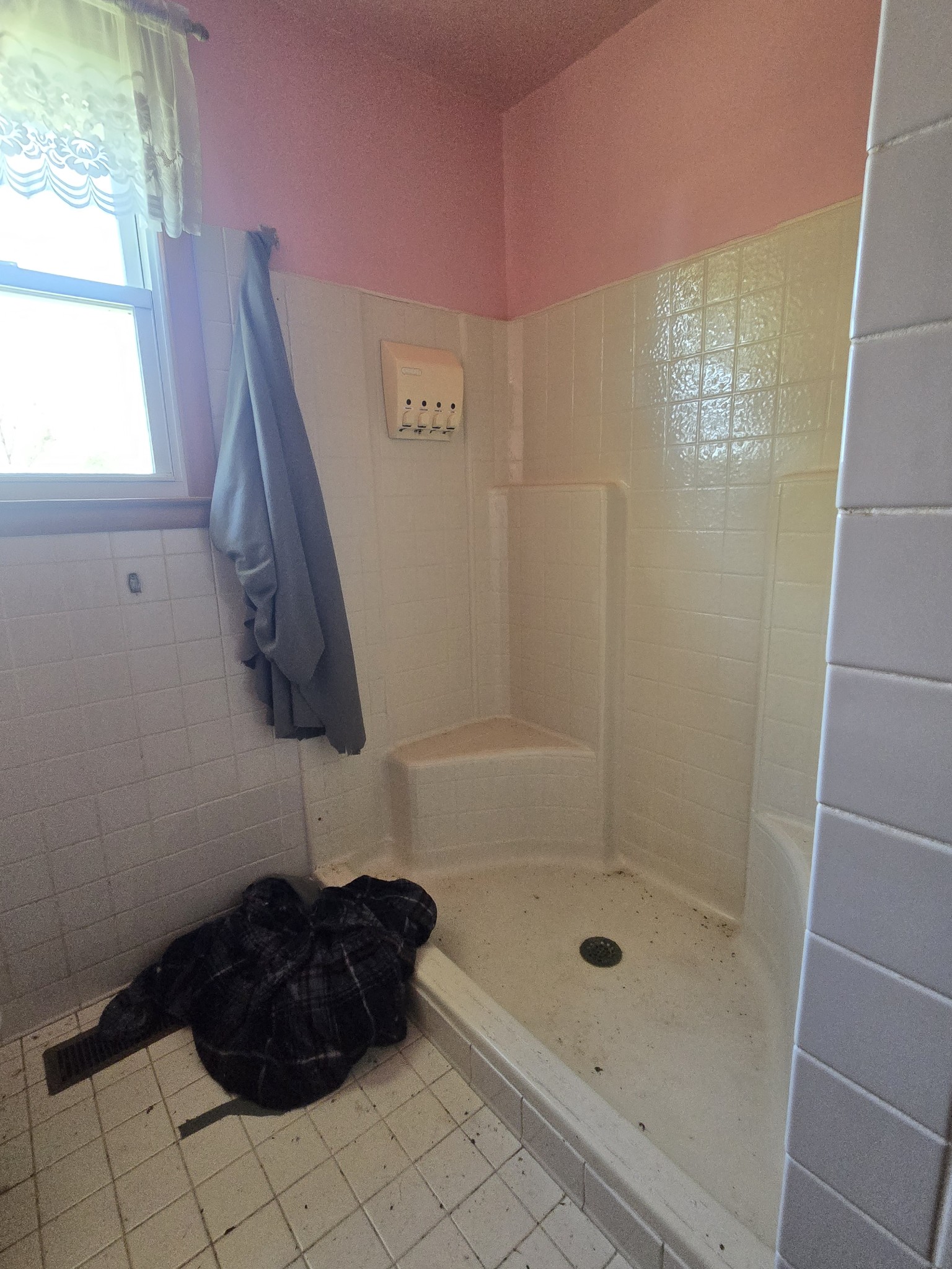 7569 Greenwood Road Cross Plains, TN 37049 - Photo 14 of 16 a bathroom with a glass shower door and a window