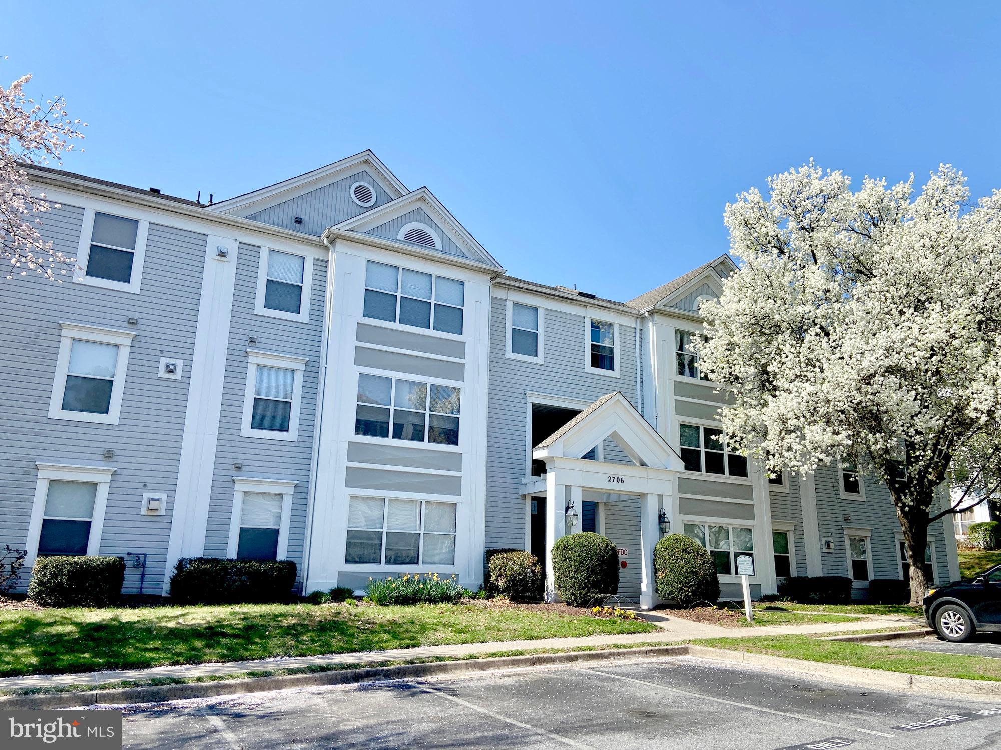 2706 Snowbird Terrace, Unit 1220 Silver Spring, MD 20906 - Photo 2 of 37 a front view of a building with a garden