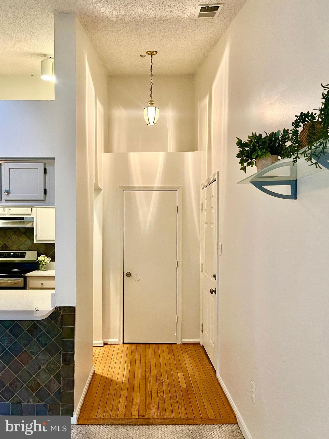 2706 Snowbird Terrace, Unit 1220 Silver Spring, MD 20906 - Photo 32 of 37 a view of a kitchen from the hallway