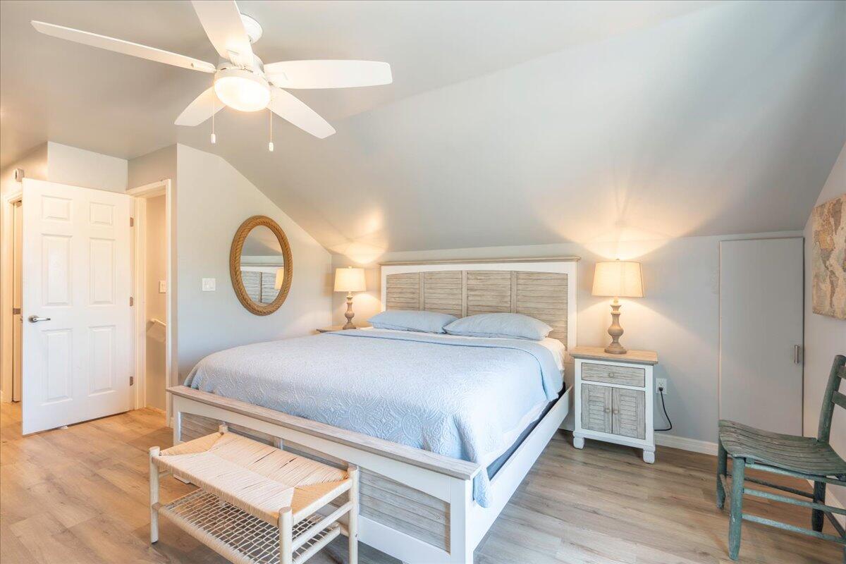 3167 Stewart Road Summerland Key, FL 33042 - Photo 26 of 33 a bedroom with a bed and a chandelier