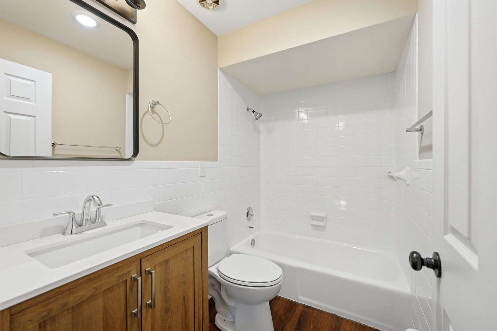 1231 Town Crest Drive, Unit E New Lenox, IL 60451 - Photo 12 of 15 a bathroom with a sink a toilet and shower