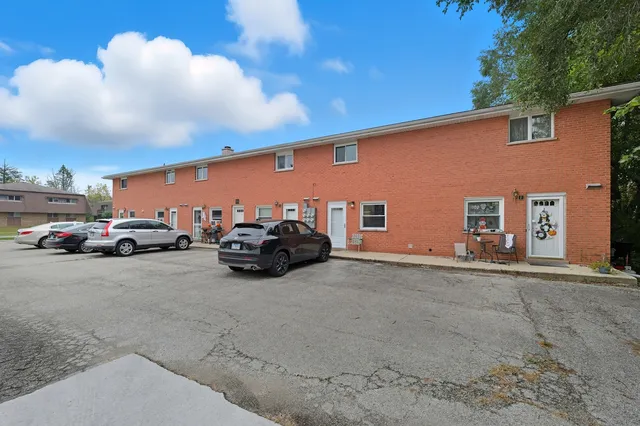 a view of a car in front of a building