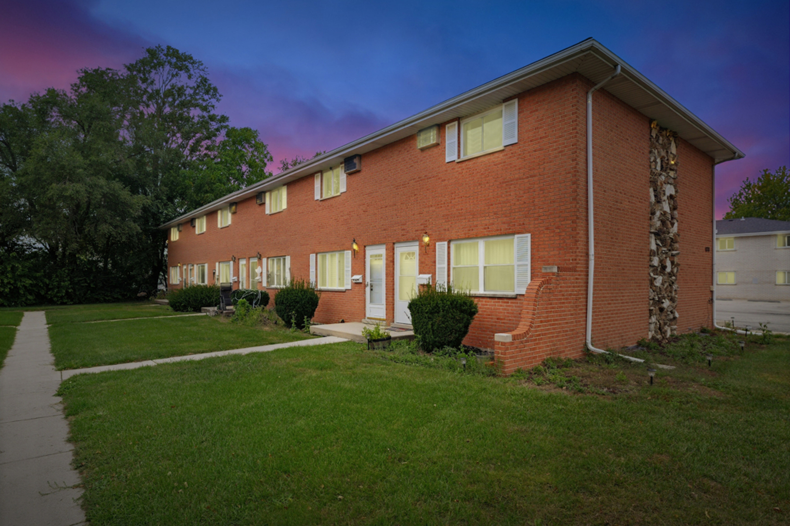 1231 Town Crest Drive, Unit E New Lenox, IL 60451 - Photo 14 of 15 a front view of a house with a yard