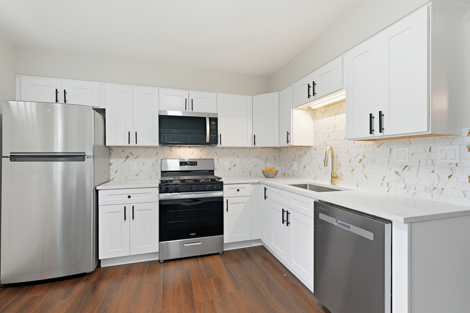 1231 Town Crest Drive, Unit E New Lenox, IL 60451 - Photo 6 of 15 a kitchen with stainless steel appliances a refrigerator sink and microwave