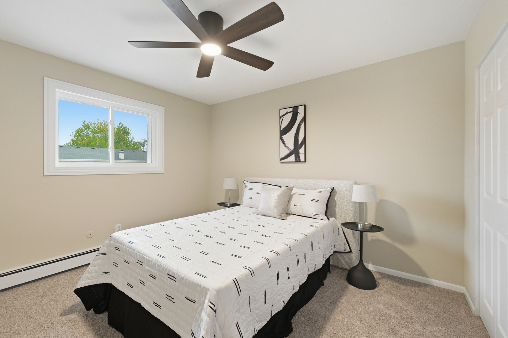 1231 Town Crest Drive, Unit E New Lenox, IL 60451 - Photo 10 of 15 a bedroom with a bed and a chandelier