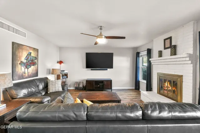 a view of a livingroom with furniture and a window
