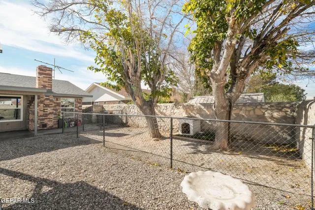 a view of a house with backyard porch and sitting area