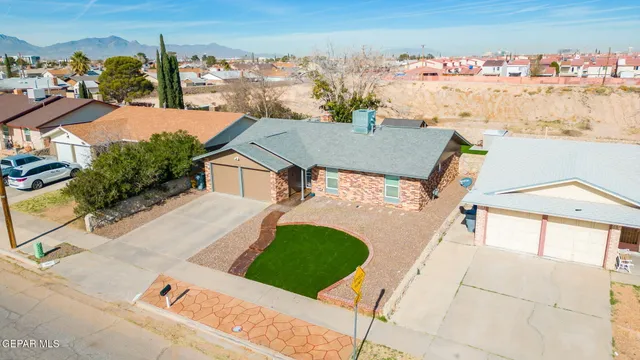 an aerial view of a house with a ocean view