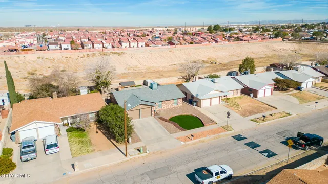an aerial view of residential houses with outdoor space
