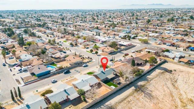 an aerial view of residential houses with outdoor space