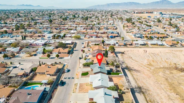 an aerial view of residential houses with outdoor space
