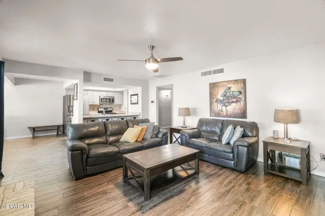 a living room with furniture and a fireplace