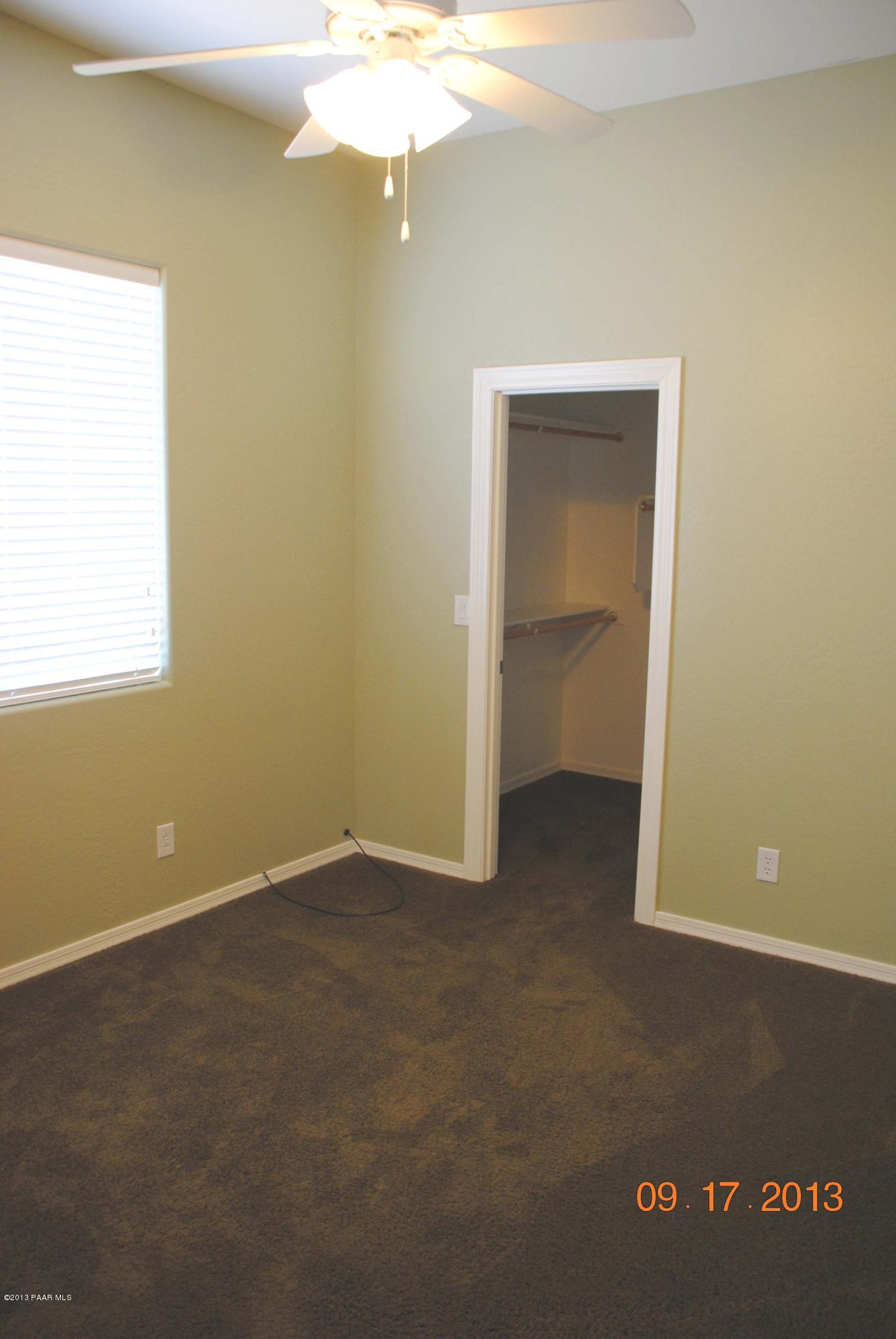 7906 East Mesteno Road Prescott Valley, AZ 86315 - Photo 16 of 24 an empty room with a fan