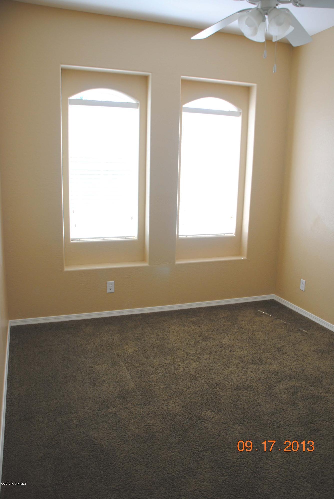 7906 East Mesteno Road Prescott Valley, AZ 86315 - Photo 17 of 24 an empty room with a window