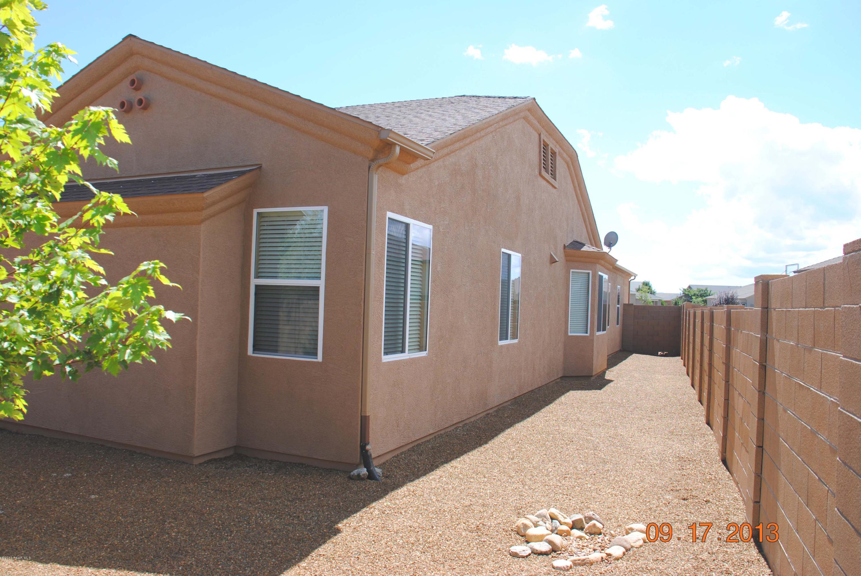 7906 East Mesteno Road Prescott Valley, AZ 86315 - Photo 22 of 24 a view of a house with a backyard