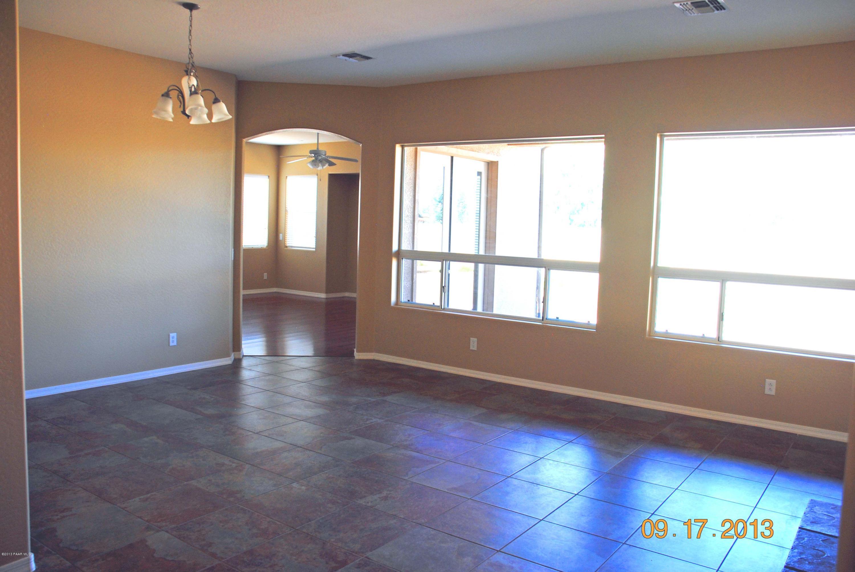 7906 East Mesteno Road Prescott Valley, AZ 86315 - Photo 7 of 24 a view of an empty room with a window