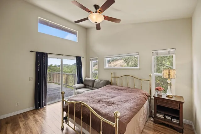 a bedroom with a bed and a table