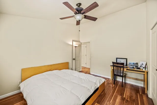 a bedroom with a bed and a table in it