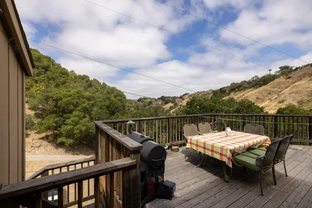 a view of a balcony with furniture