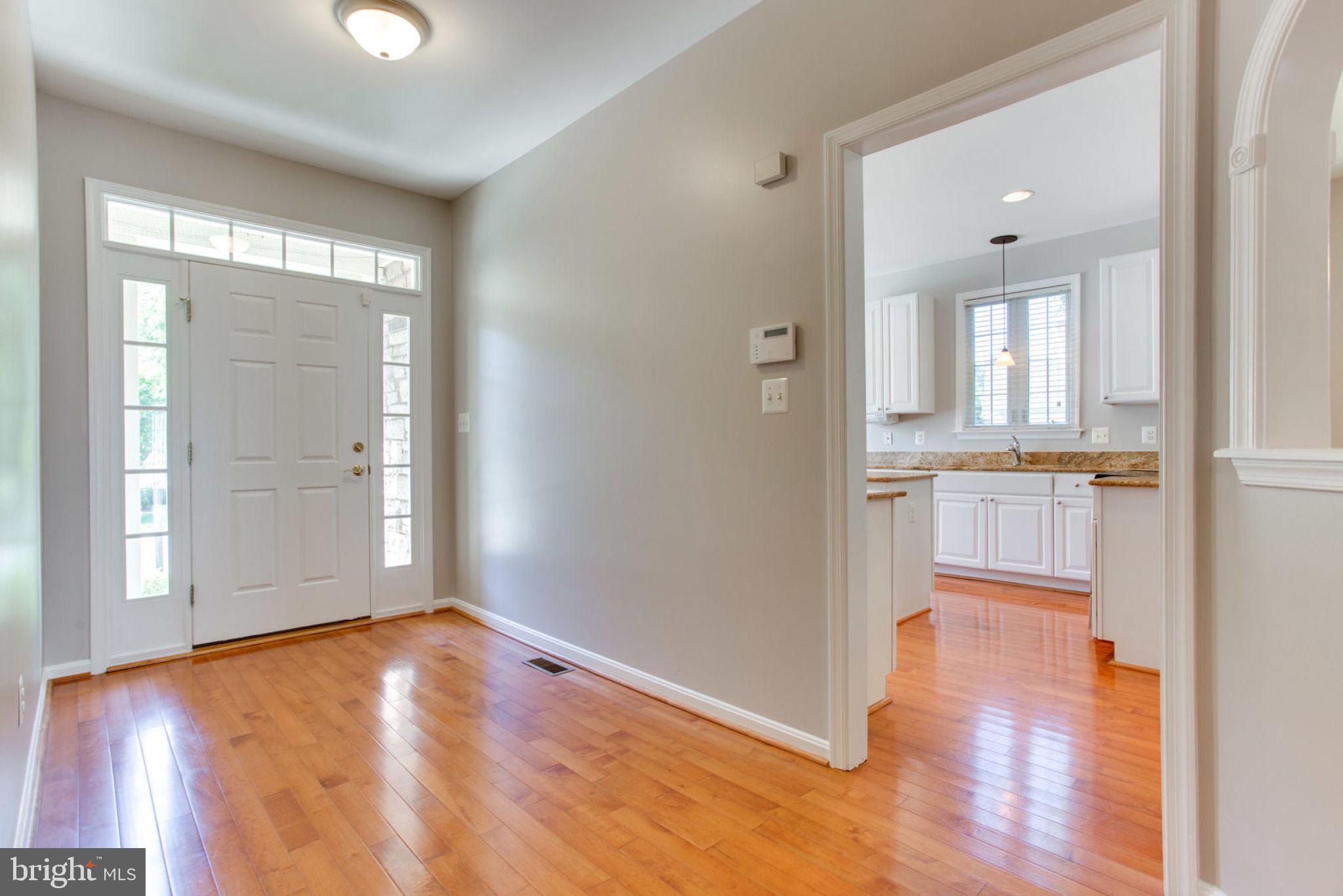 13550 Ryton Ridge Lane Gainesville, VA 20155 - Photo 3 of 46 Hardwoods Foyer, Hallways and Kitchen