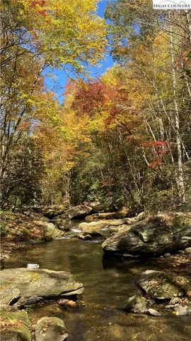 a view of a backyard with sitting area