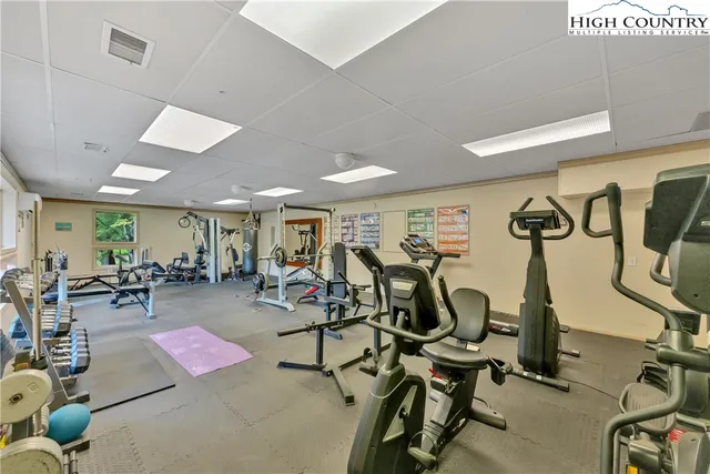 a living room with lots of furniture and wooden floor