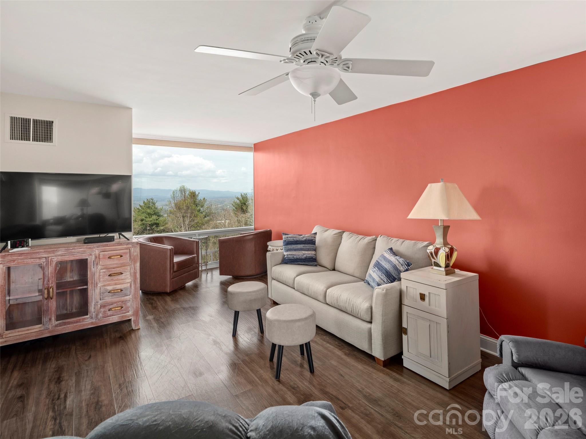 647 Town Mountain Road, Unit 612 Asheville, NC 28804 - Photo 2 of 10 a living room with furniture and a flat screen tv