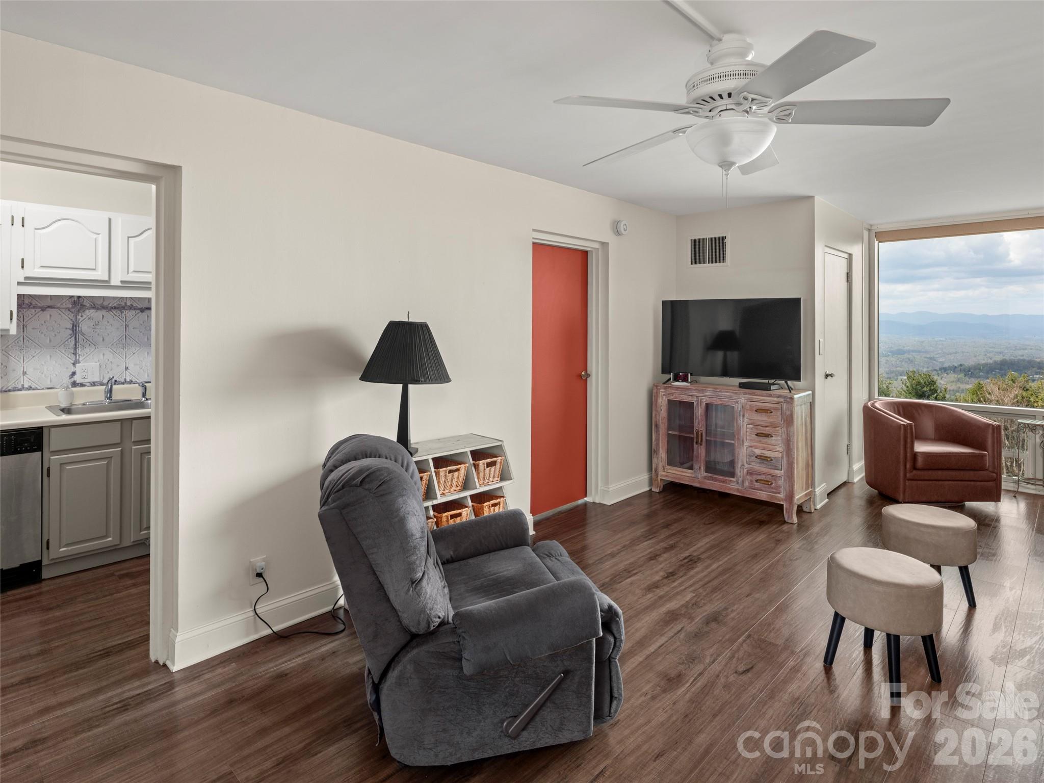 647 Town Mountain Road, Unit 612 Asheville, NC 28804 - Photo 3 of 10 a living room with furniture and a flat screen tv