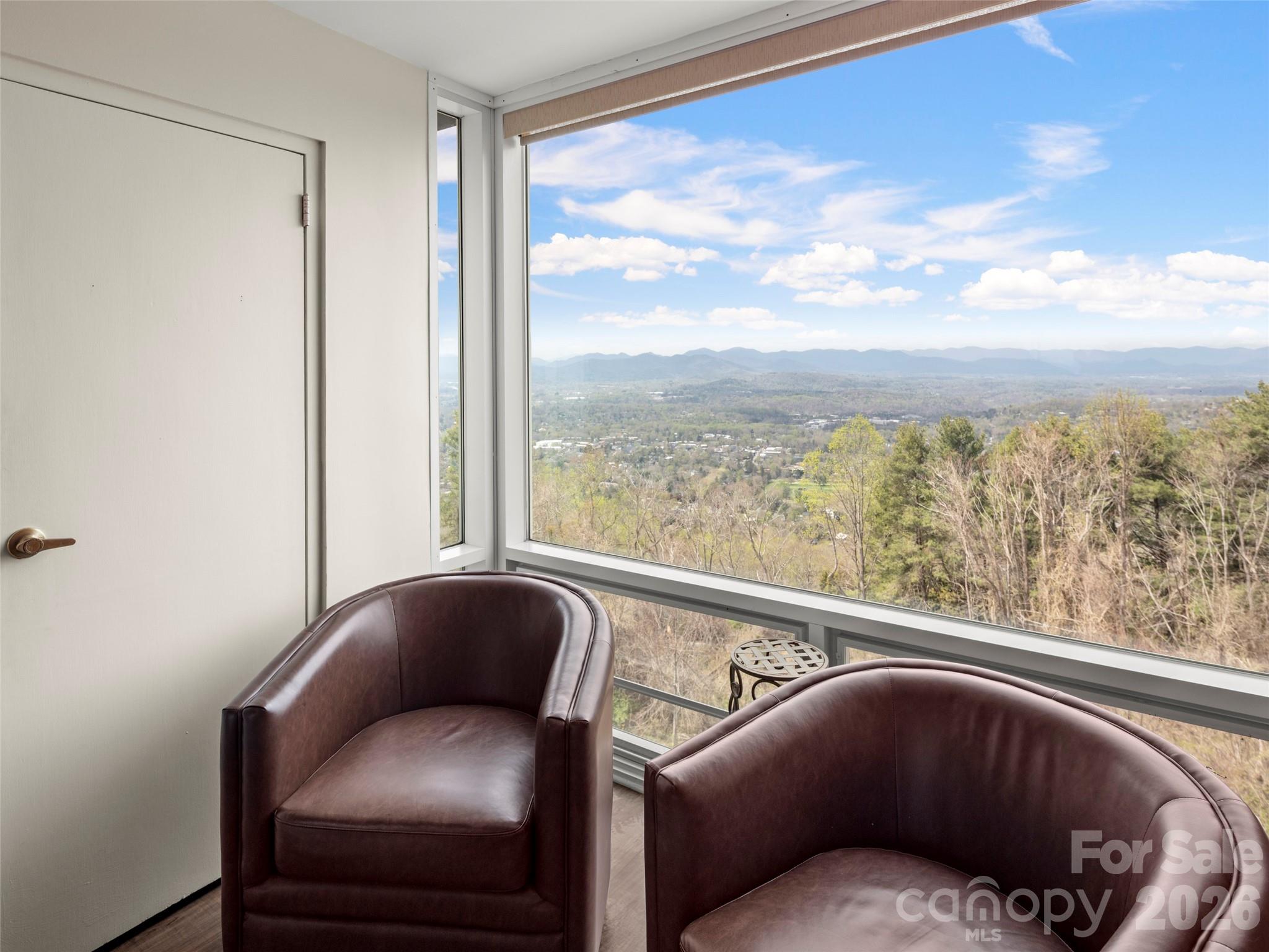 647 Town Mountain Road, Unit 612 Asheville, NC 28804 - Photo 6 of 10 a balcony with furniture and a large window