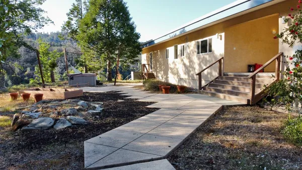 a backyard of a house with lots of green space