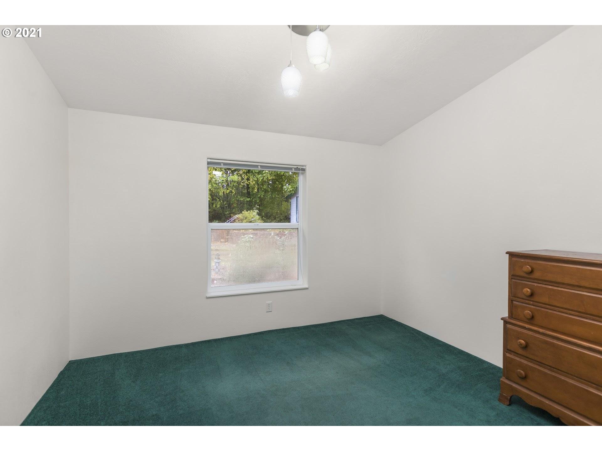 212 Northeast 253rd Street Ridgefield, WA 98642 - Photo 14 of 28 an empty room with a window