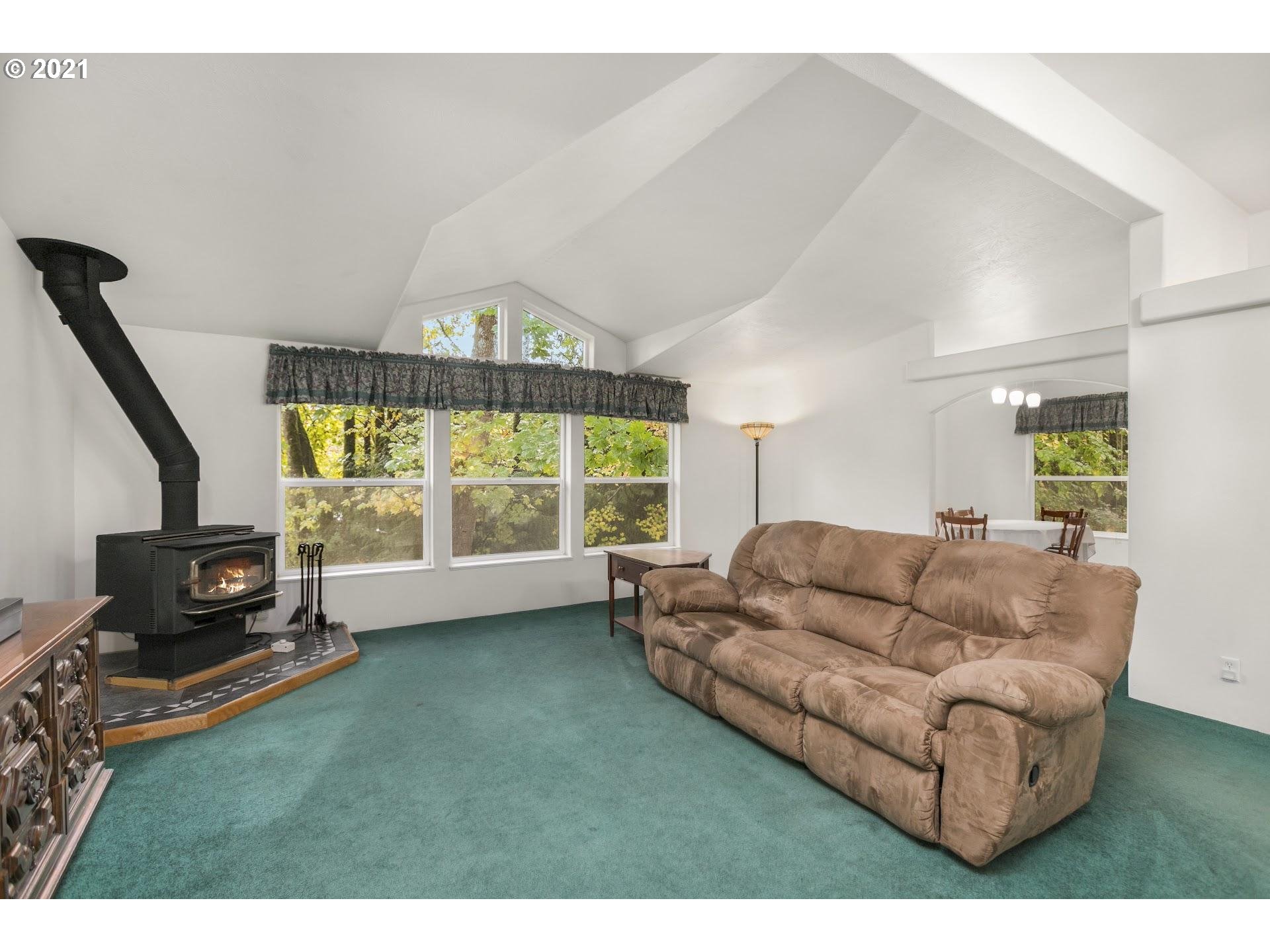 212 Northeast 253rd Street Ridgefield, WA 98642 - Photo 7 of 28 a living room with furniture and a flat screen tv