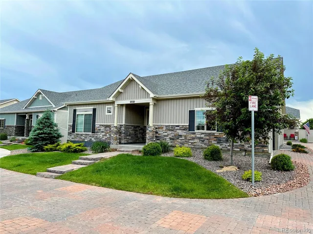 a front view of a house with a yard and porch