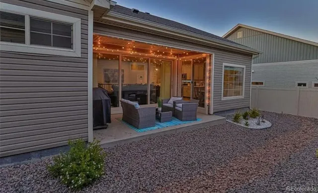 a view of a patio with chair and tables