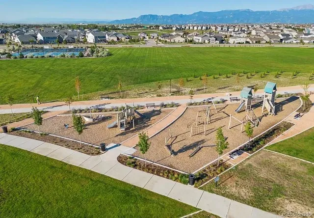 a view of a swimming pool with a yard
