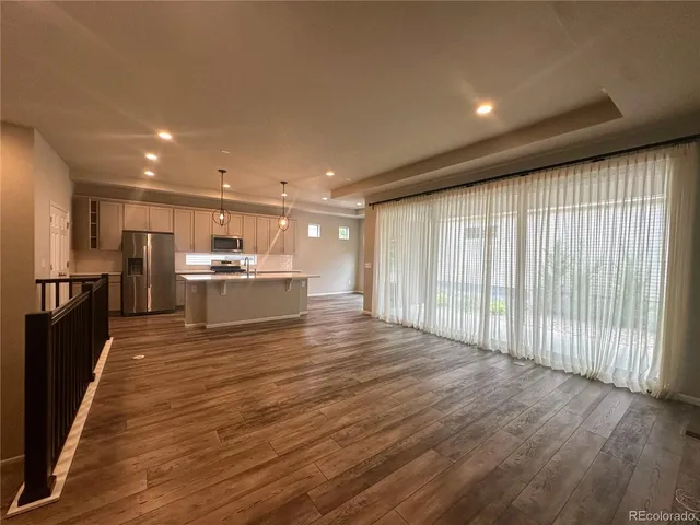 a view of kitchen with wooden floor