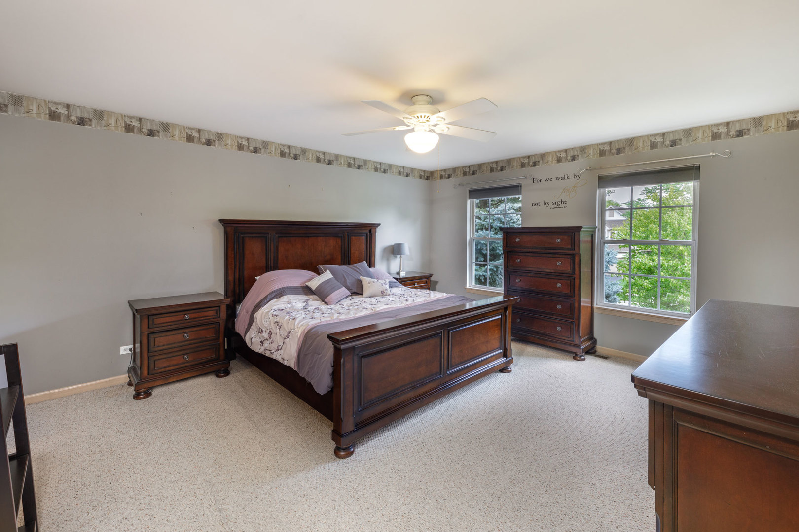 11654 Olympic Drive Plainfield, IL 60585 - Photo 14 of 25 a bedroom with a bed and window