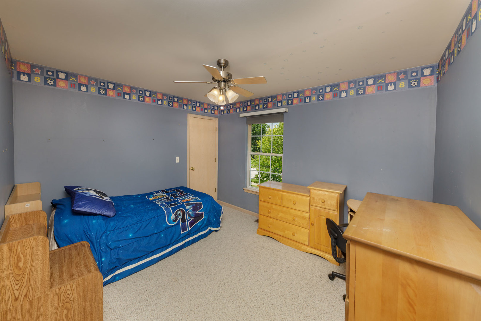 11654 Olympic Drive Plainfield, IL 60585 - Photo 17 of 25 a bedroom with a bed and window