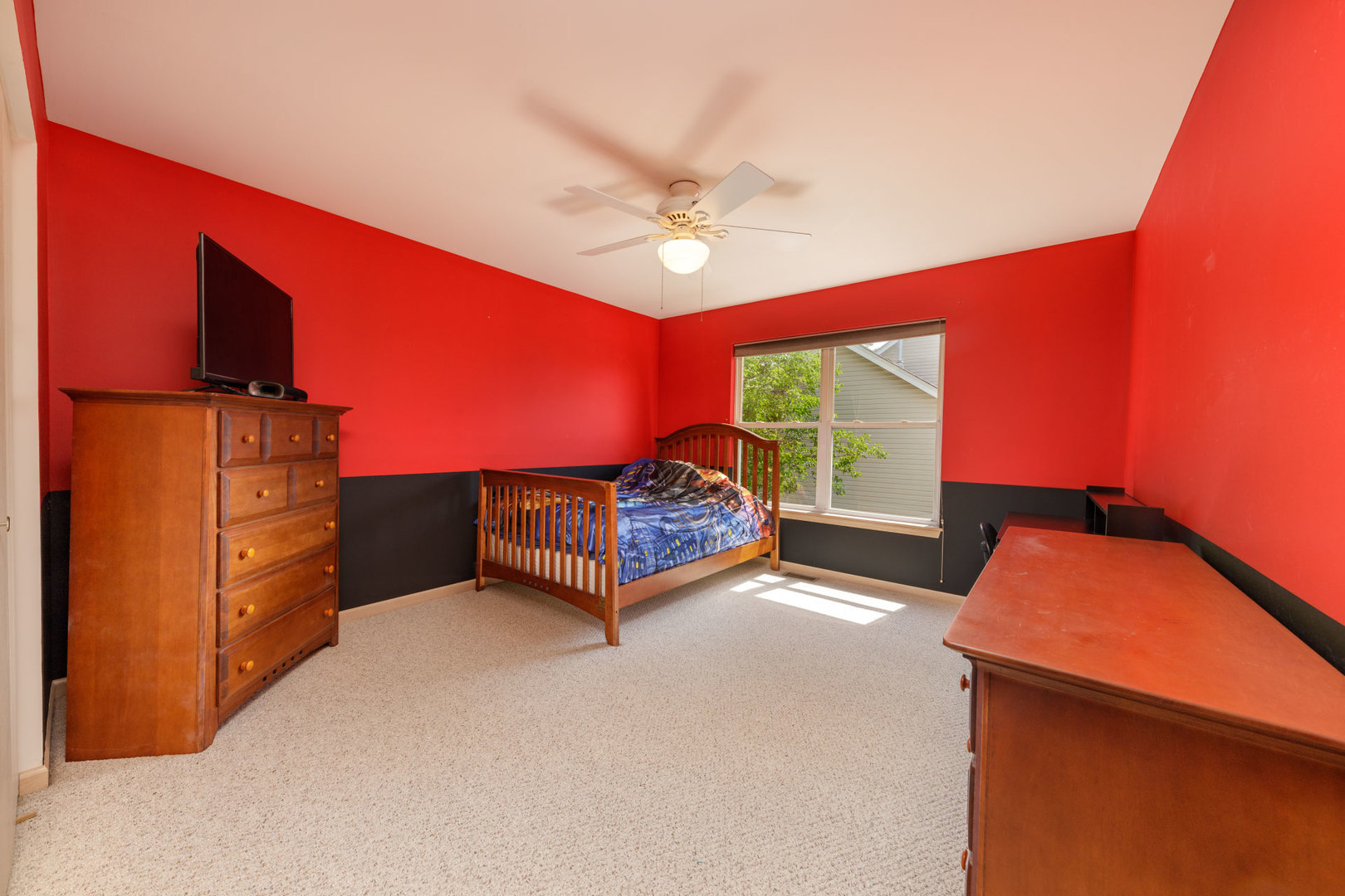 11654 Olympic Drive Plainfield, IL 60585 - Photo 18 of 25 a bedroom with furniture and a window