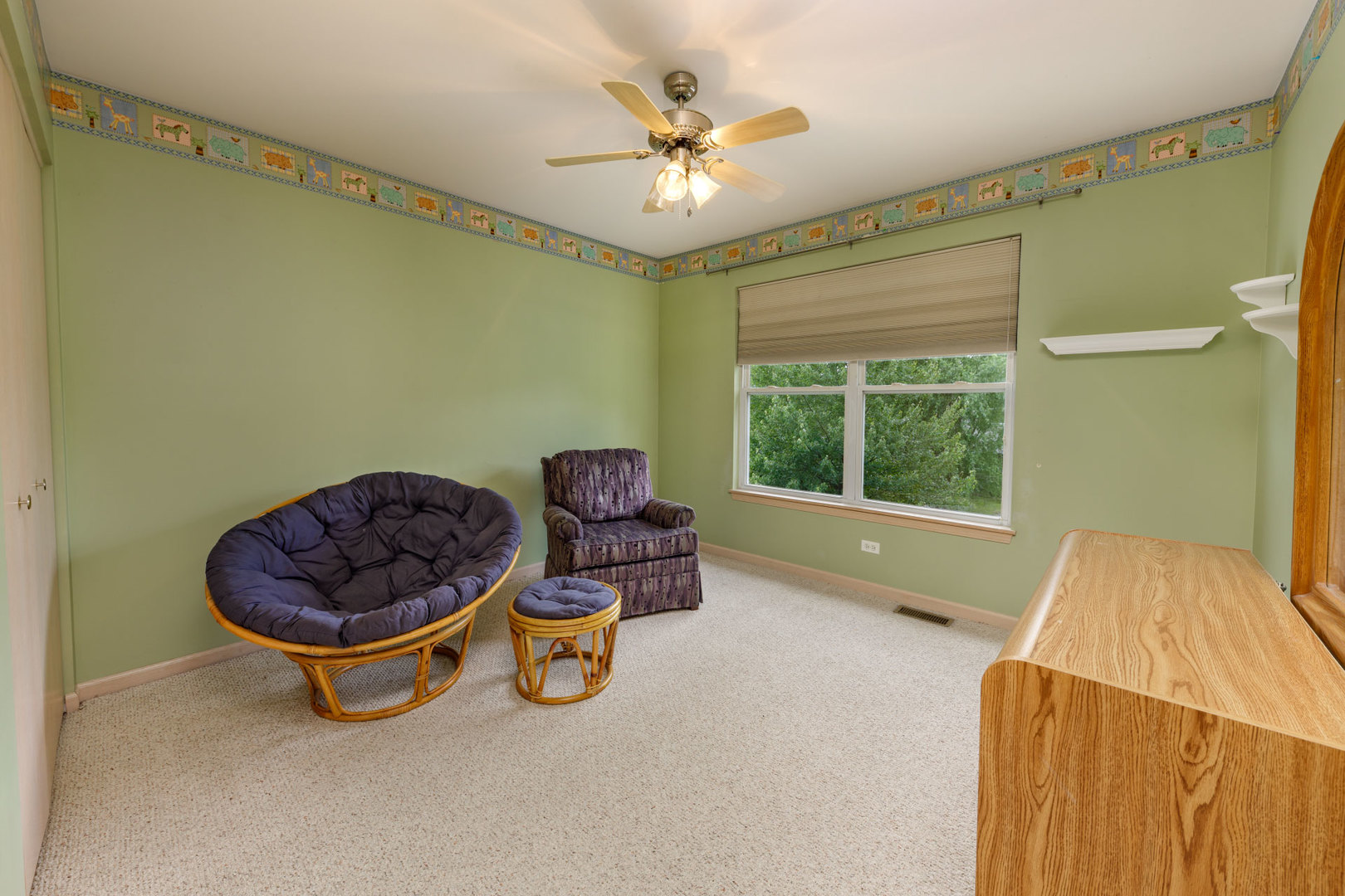 11654 Olympic Drive Plainfield, IL 60585 - Photo 19 of 25 a room with a chandelier and a rug