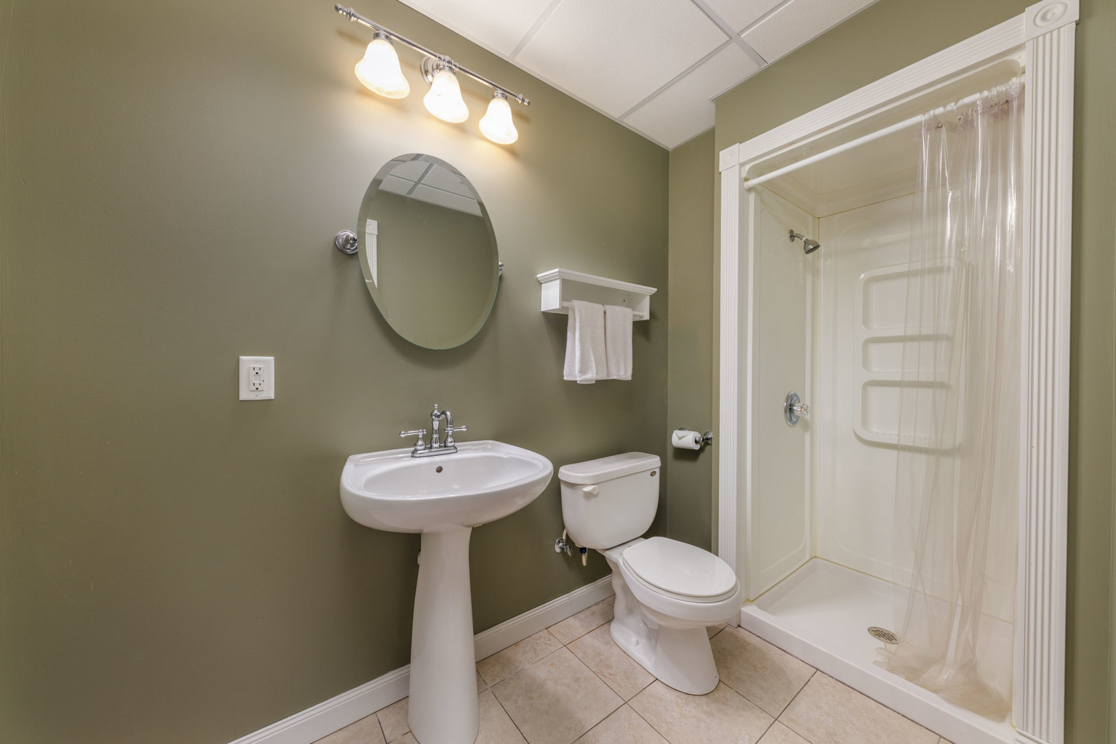 11654 Olympic Drive Plainfield, IL 60585 - Photo 22 of 25 a bathroom with a toilet sink and mirror