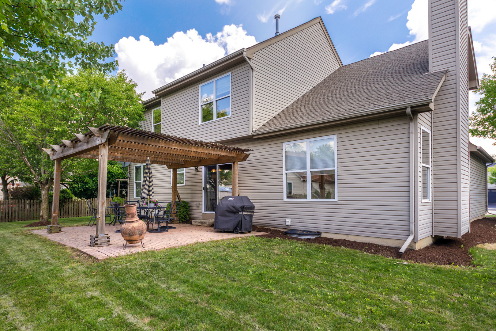 11654 Olympic Drive Plainfield, IL 60585 - Photo 25 of 25 a view of a house with a backyard
